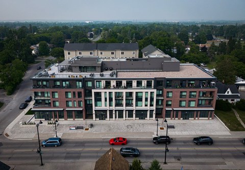 A large building with a parking lot in front of it.