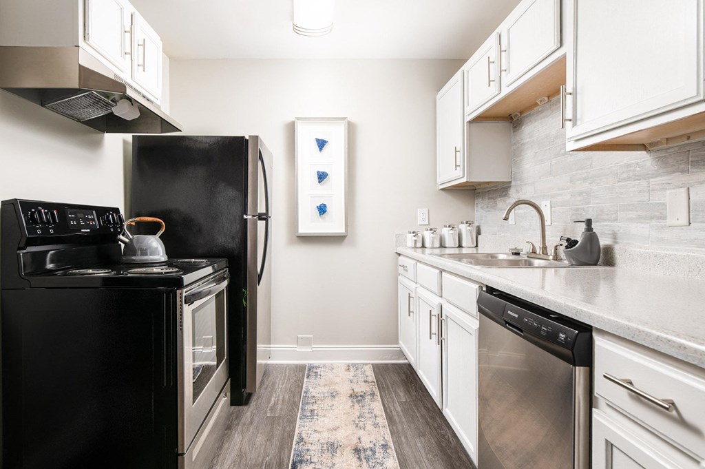 Fully Equipped Kitchen Includes Frost-Free Refrigerator, Electric Range, & Dishwasher at Elite At Lakeview, College Park, Georgia