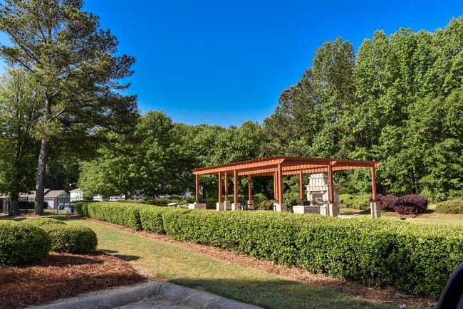 a park with a wooden pavilion