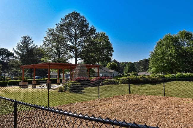 a park with a playground and a pavilion