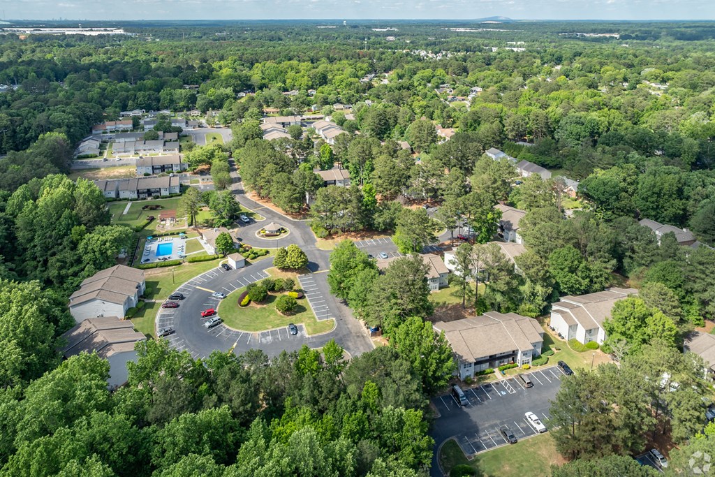 an aerial view of a neighborhood with houses and trees