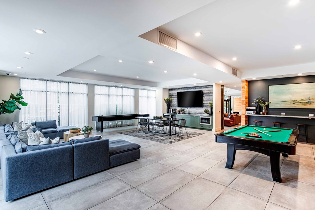 a living room with a pool table