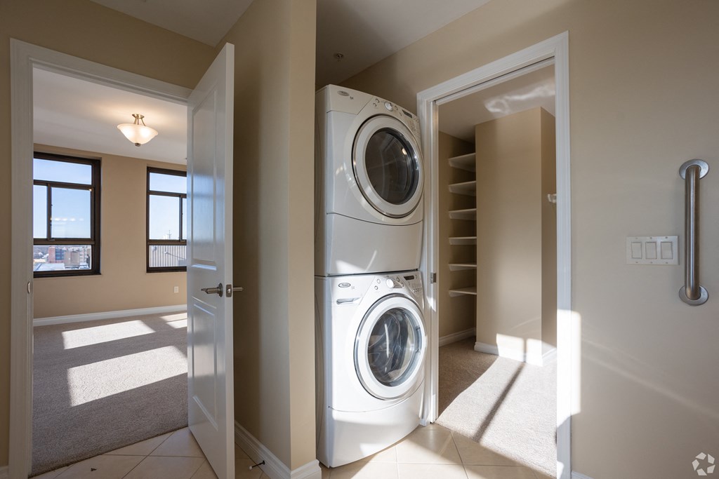 a front loading washer and dryer in a laundry room