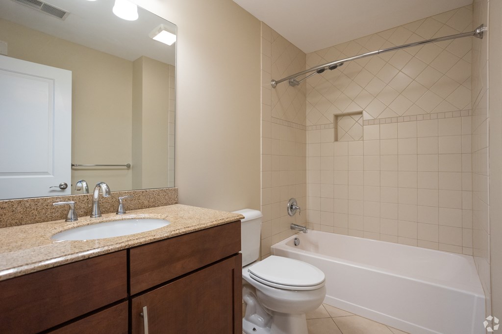 a bathroom with a sink toilet and tub and a shower
