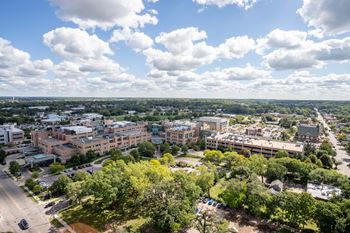 an aerial view of a city with buildings and trees