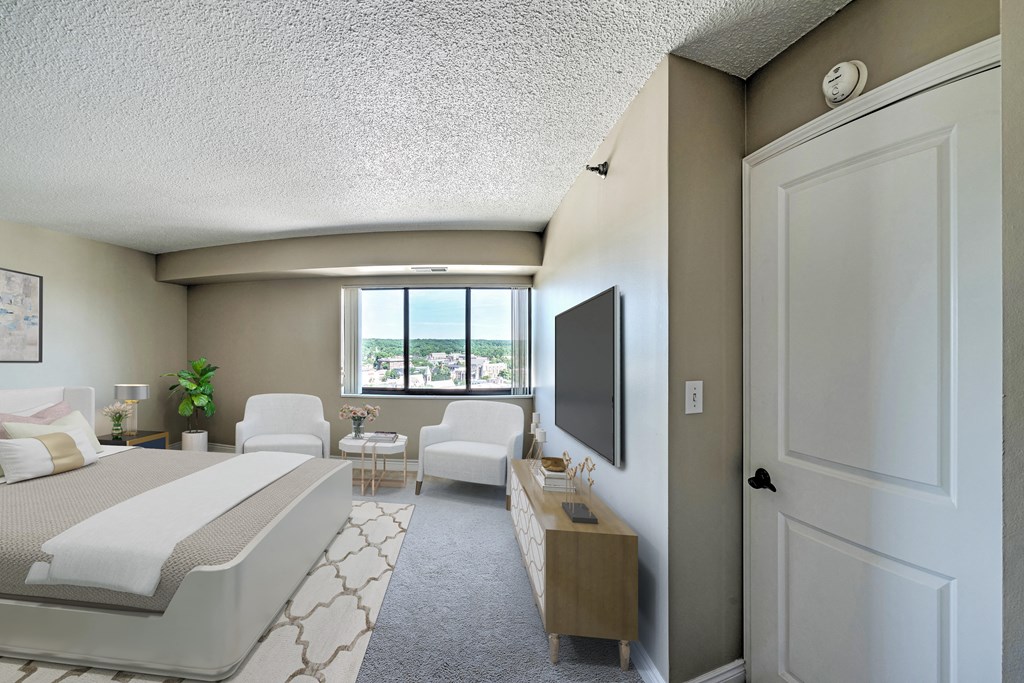 a hotel room with a bed and a tv in it