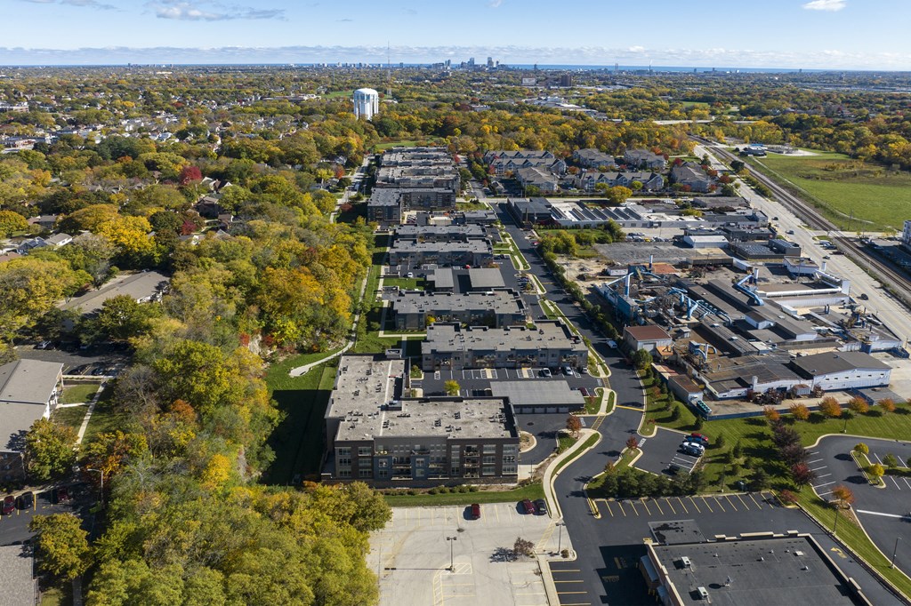 an aerial view of a city with many buildings and trees