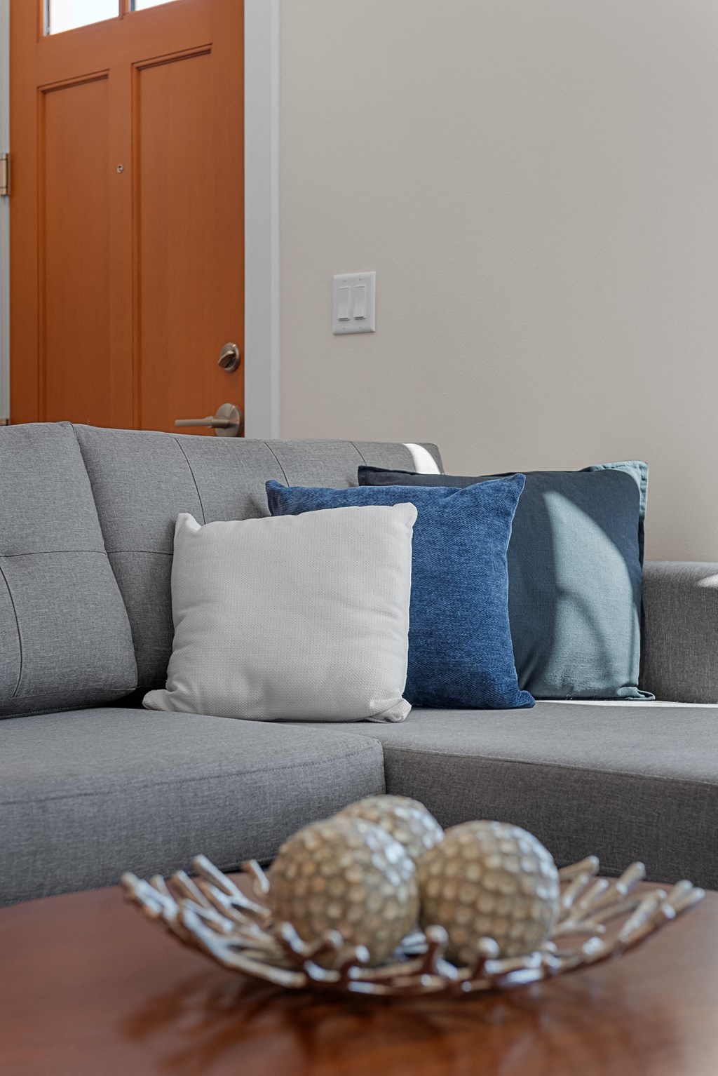 a living room with a couch and a coffee table at Tivoli Green Apartments & Townhomes, Mount Pleasant, WI