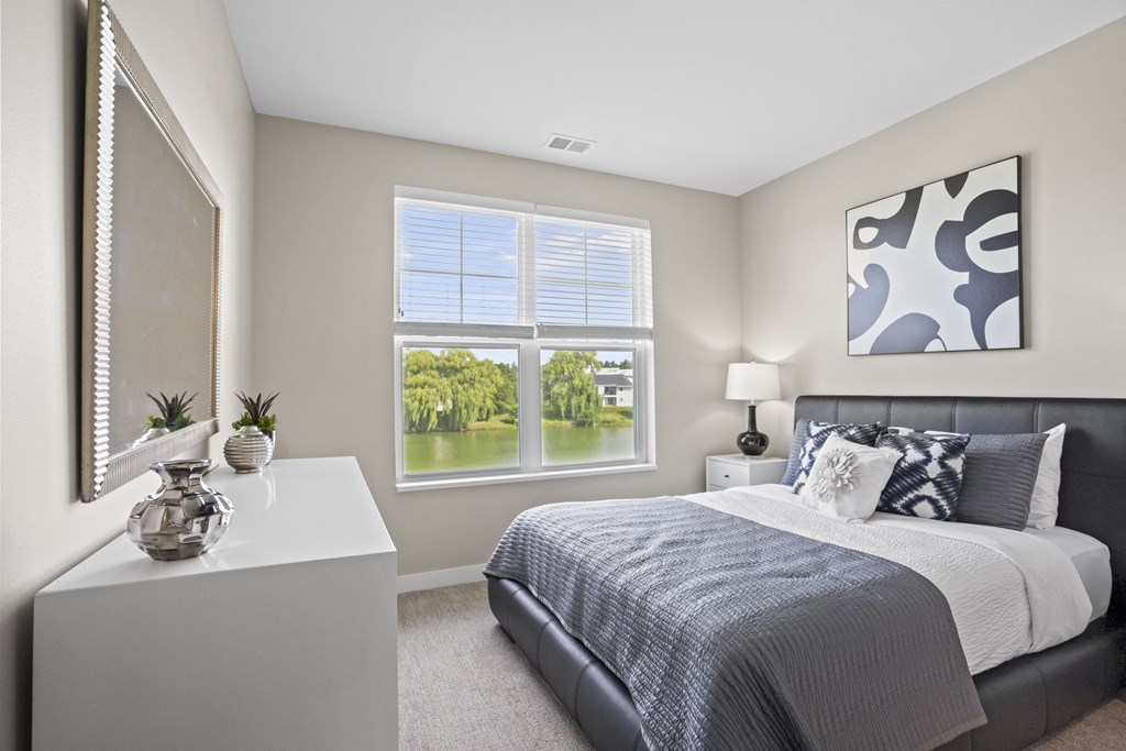 an example of a bedroom with a bed and a window