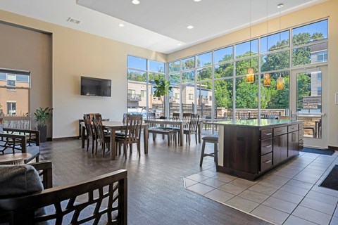 A modern living room with a flat screen TV mounted on the wall.