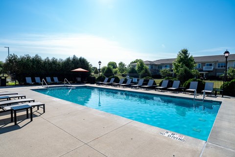A pool with a blue water and a sign that says "NO DIVING".