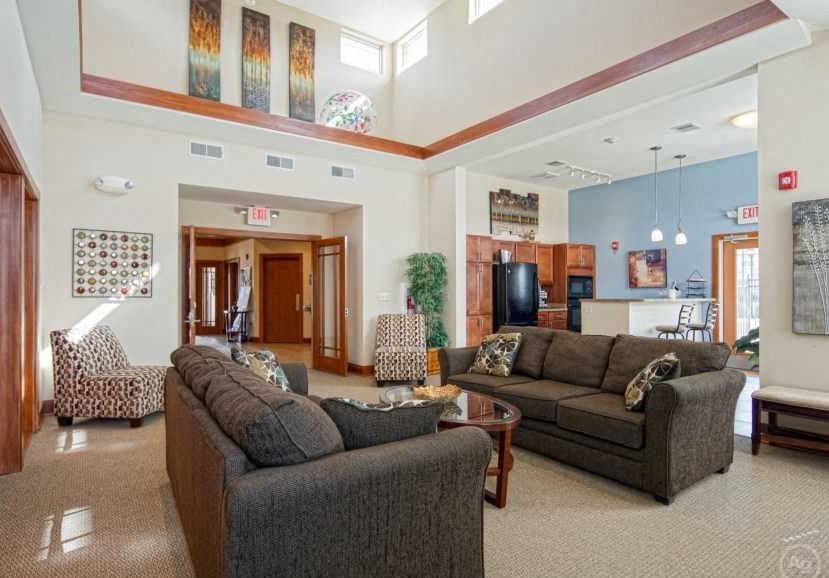 a living room with two couches and a table