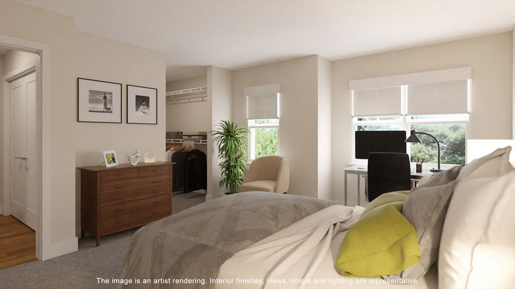 a bedroom with a bed and a desk and a living room  at Tivoli Green Apartments & Townhomes, Wisconsin