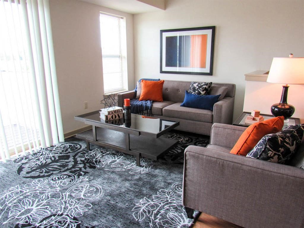 a living room with couches and a coffee table