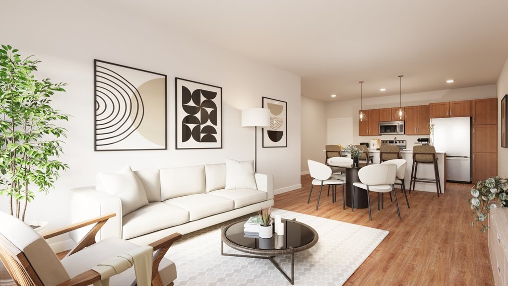 A modern living room with a white couch, wooden chairs, and a coffee table. A modern living room with a white couch, wooden chairs, and a coffee table.at The Landing at Hub City, Plymouth, 53073