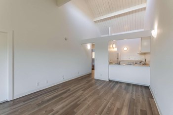 living room with view of kitchen - Photo Gallery 10