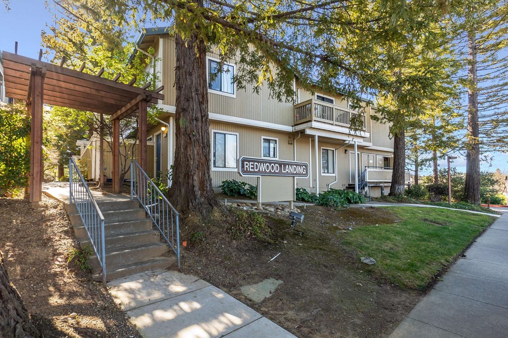 exterior of apartment building with Redwood Landing sign exterior of apartment building with Redwood Landing sign at Redwood Landing Apartments, California, 94947