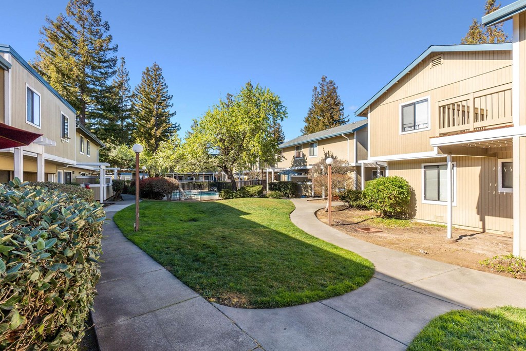 view of apartment buildings and landscaping