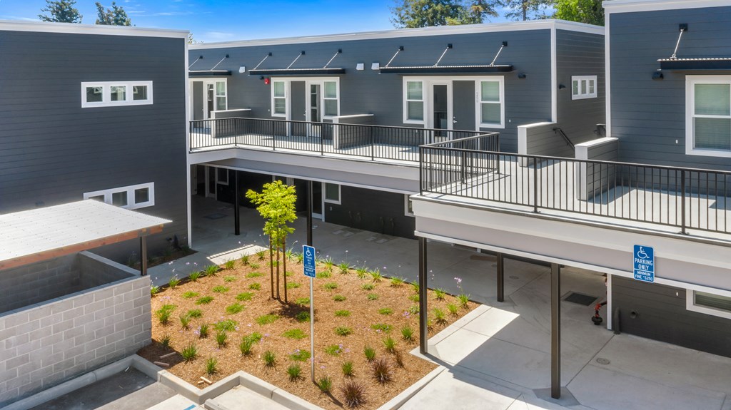 outdoor view of apartments with landscaping