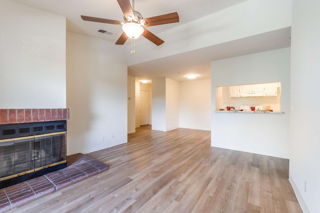 Living room facing kitchen and fireplace