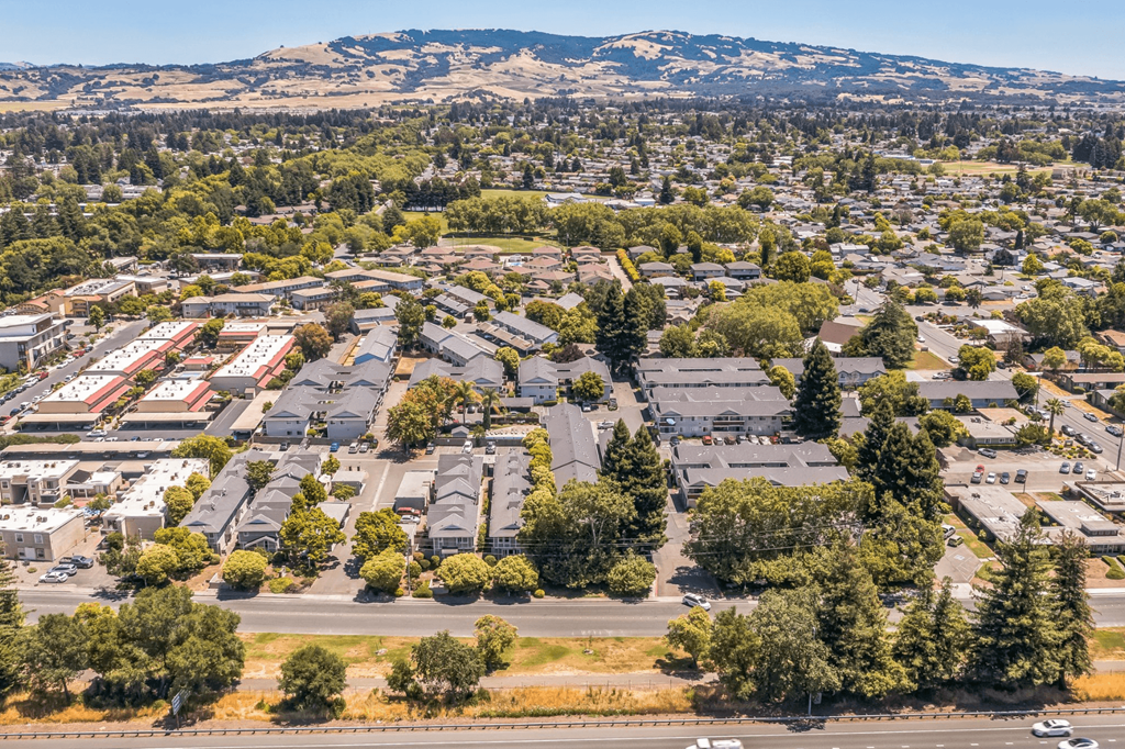 A suburban area with a mix of houses and trees.