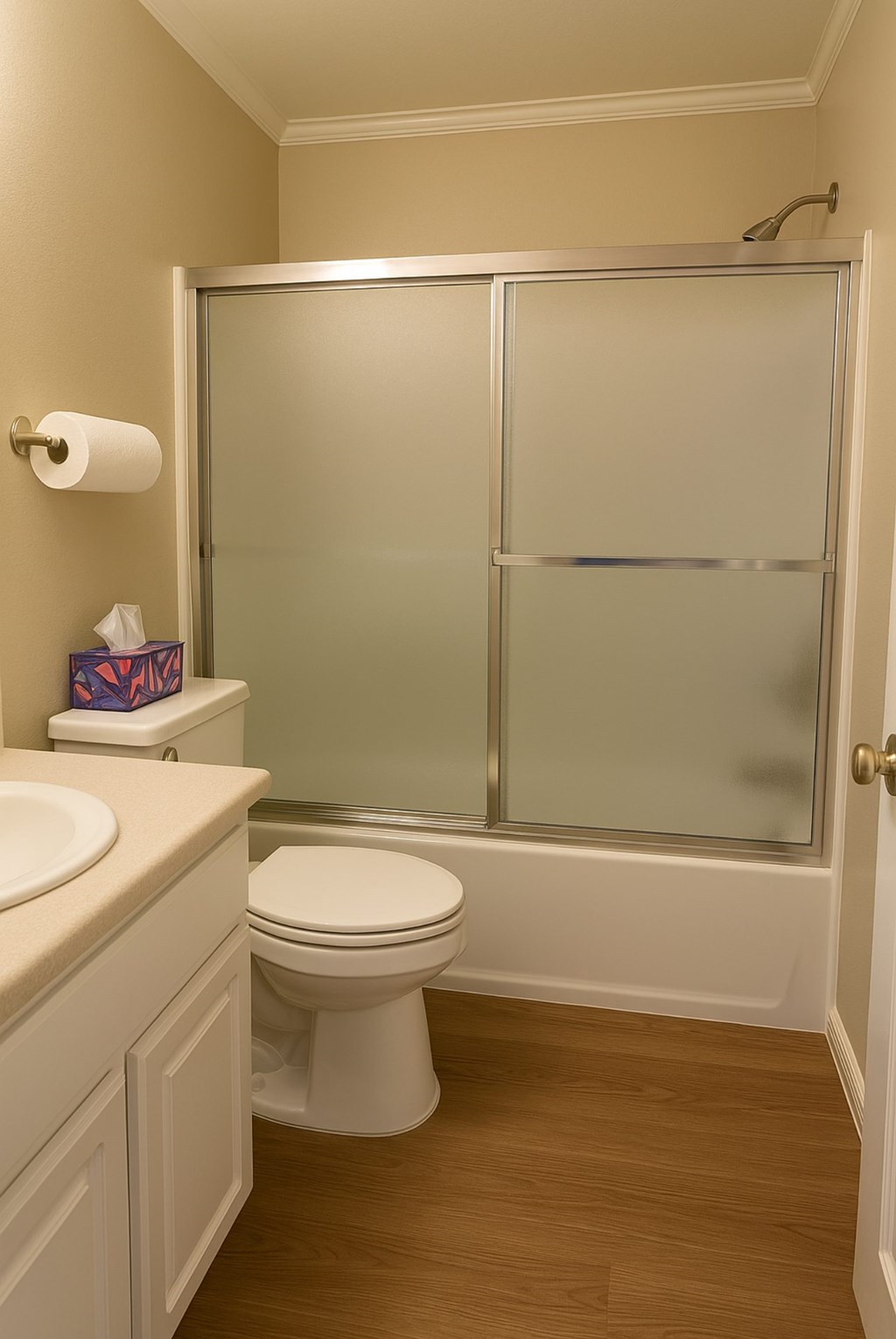 A white toilet sits next to a sink in a bathroom.at Posada West, Novato, CA 94949