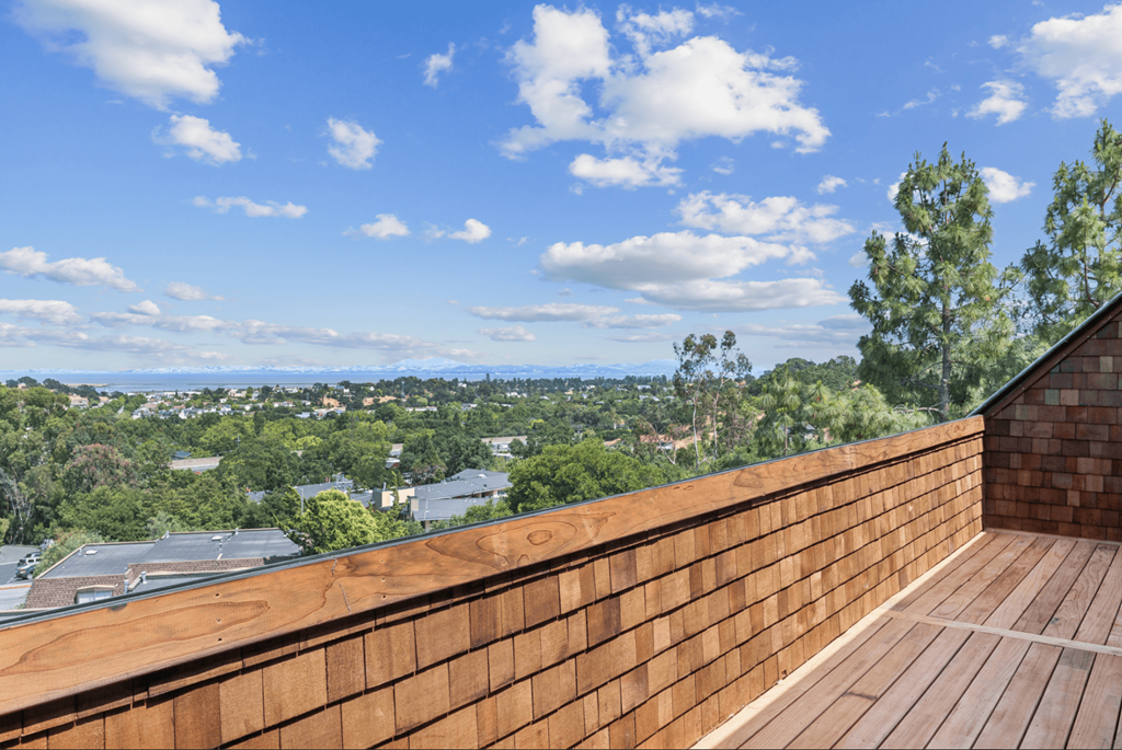 A wooden deck overlooks a cityscape.at Posada West, Novato, CA