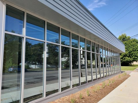 the side of a building with glass windows