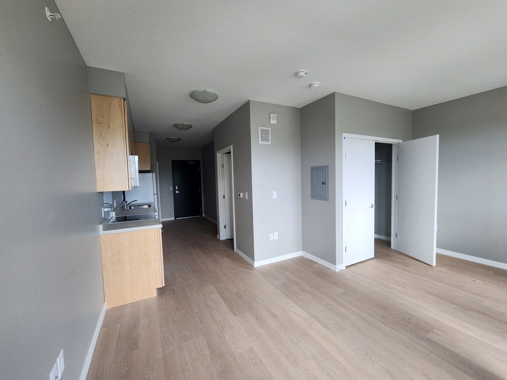 a view of the living room and kitchen of a new home