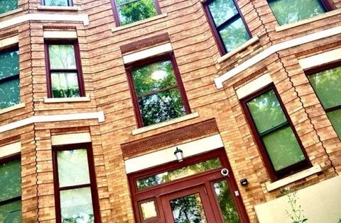 A building with red bricks and windows.