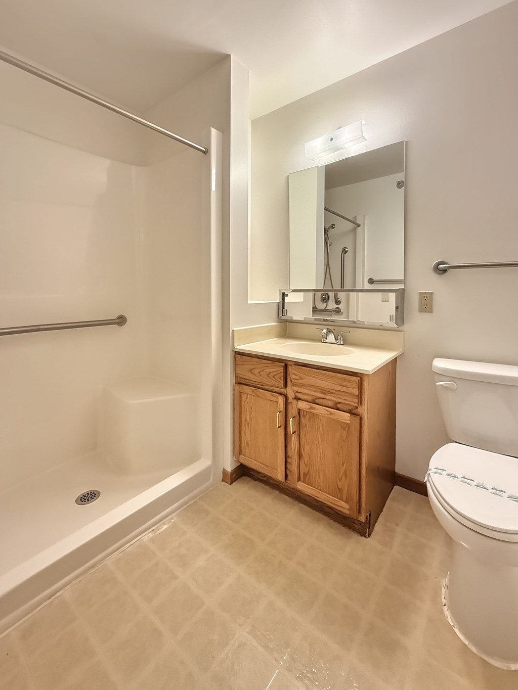 A bathroom with a toilet, sink, and bathtub.