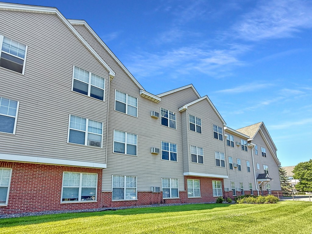 A large apartment building with multiple windows and balconies.