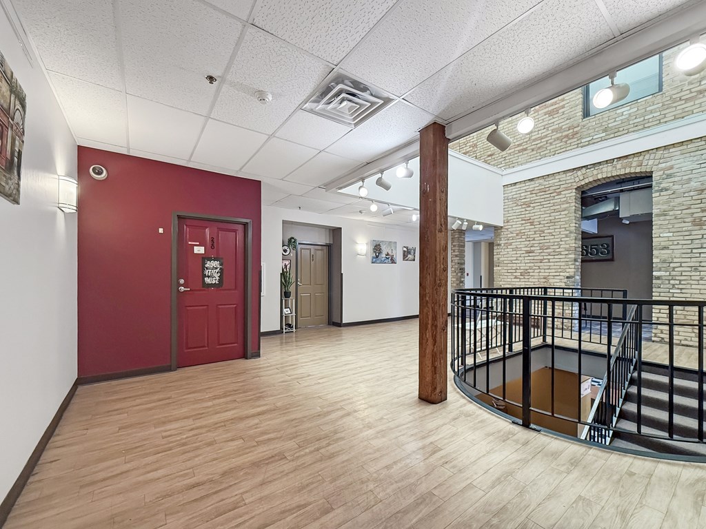 A red door is on the left side of the image.