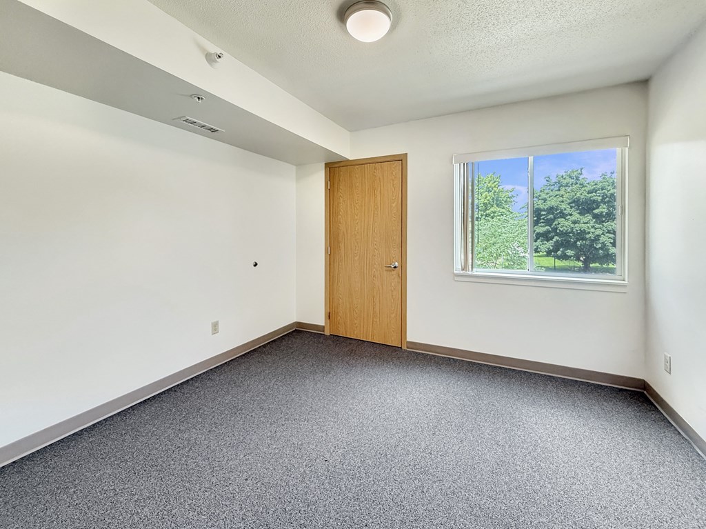 A room with a door and a window.