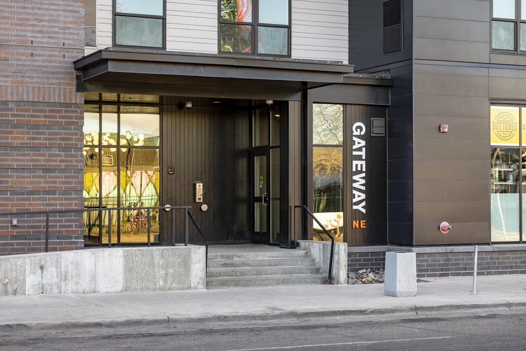 A building with a black door and a sign that says "GATEWAY NE".