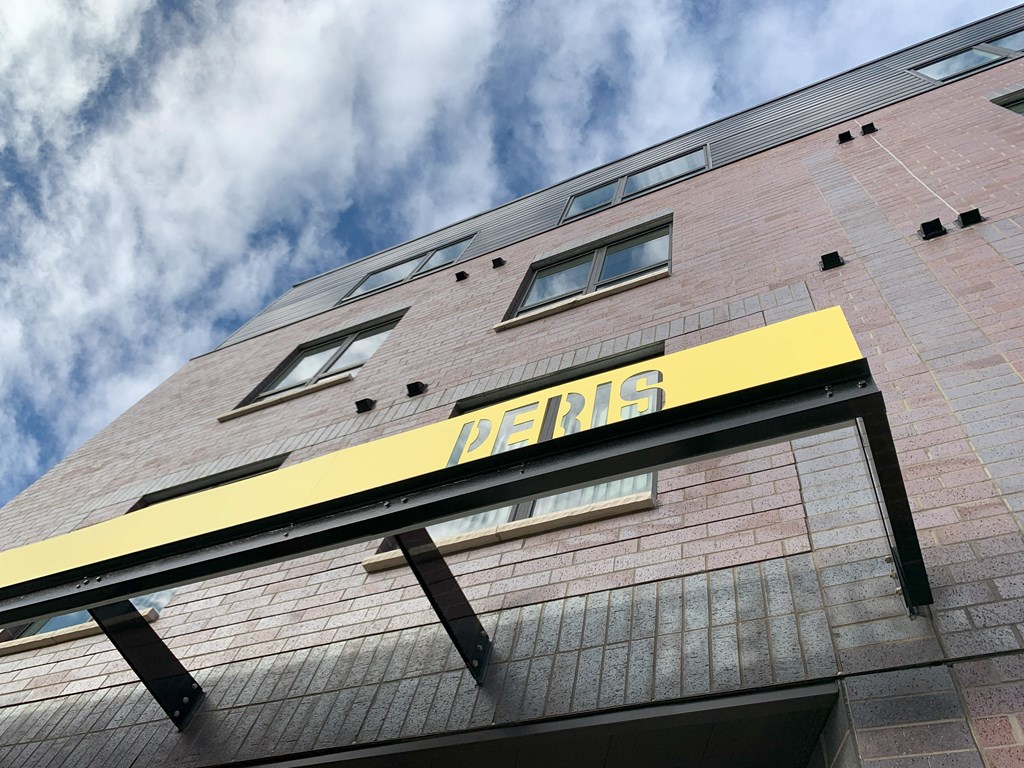 the facade of a building with a sign on it