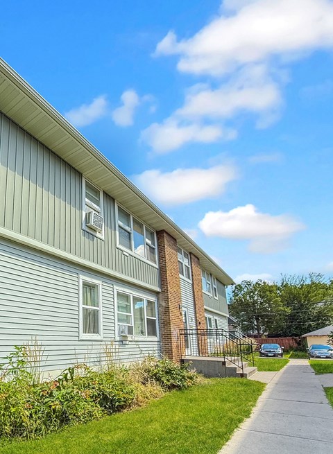 A residential building with a clear blue sky above.