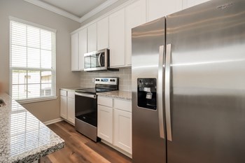 Upscale Stainless Steel Kitchen Appliances With Double Door Refrigerator at Lakeside Conroe, Texas, 77356 - Photo Gallery 32