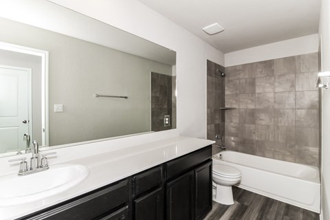 a bathroom with a toilet sink and bathtub