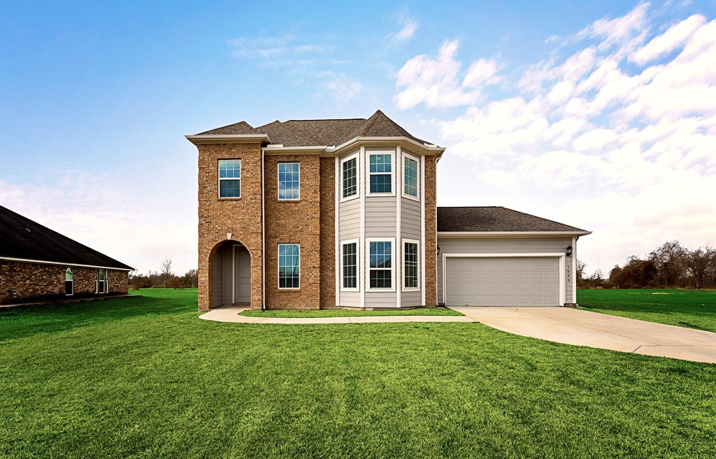 a large house with a lawn in front of it
