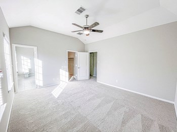 Carpeted Bedroom Carpeted Bedroom at Villas at Kings Harbor, Texas - Photo Gallery 6