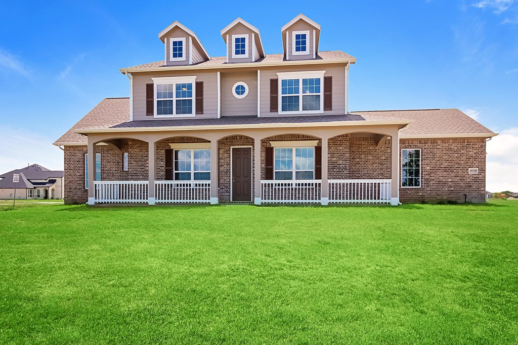 a large house with a lawn in front of it