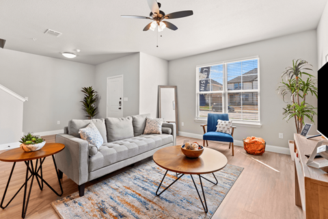 a living room with a couch and a table