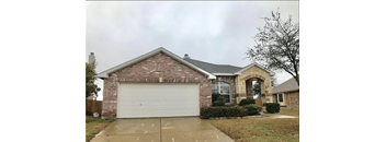a house with a white garage door in front of it