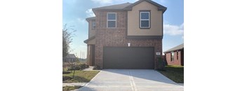 a house with a driveway and a garage door