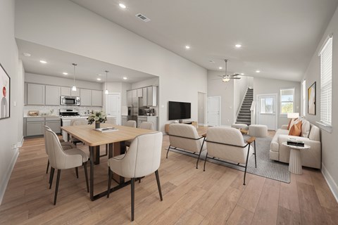 A modern dining room with a wooden table and chairs.