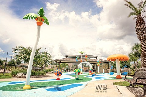 A playground with a slide and a palm tree.