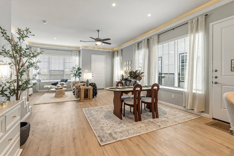 A well-lit, spacious dining area with a table set for six.
