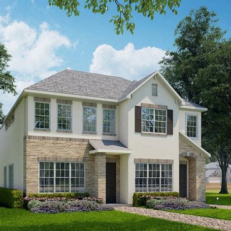 a white house with a lawn and a tree