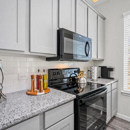 a kitchen with a stove and a microwave